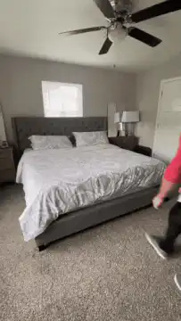 Person jumps on bed and bounces