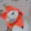 Cat in orange flower hat