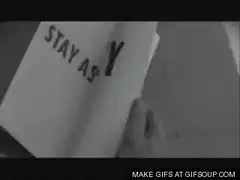 Hand flipping through book of commands