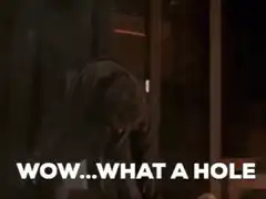 Man looks up at hole