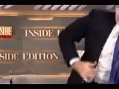 Man adjusts pants and makes shocked face