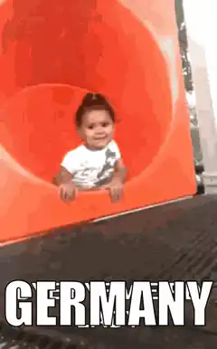Baby slides down orange tube