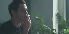 Pete Davidson smoking and exhaling