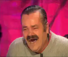 Joel McHale laughing hysterically