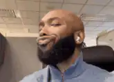 Man with beard making funny face