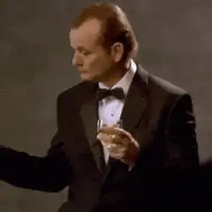 Bill Murray pointing with drink
