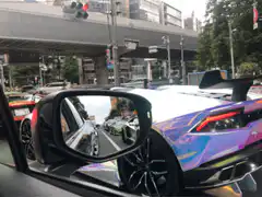 Iridescent Lamborghini in traffic