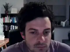 Man looking down with a tired expression