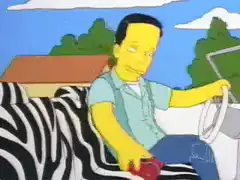 Homer Simpson gets zapped by a remote