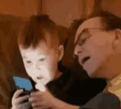 Boy slaps man while looking at phone