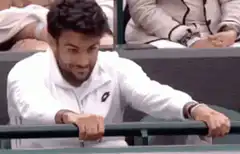 Man shaking railing intensely