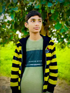 Boy in striped hoodie outdoors