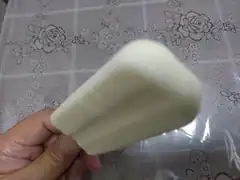 hand holding white popsicle
