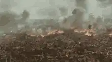 Soldiers charging across a battlefield