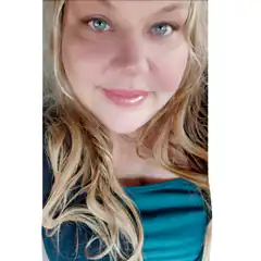 blonde woman smiling at camera