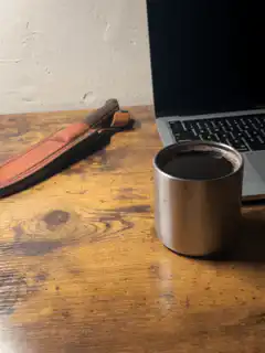 coffee cup on wooden desk