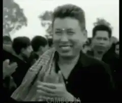 Pol Pot smiling and clapping