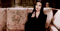 Anjelica Huston as Morticia Addams