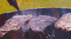 Steaks sizzling on a grill