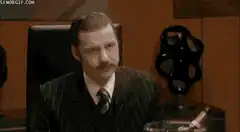 Hannibal Lecter stands up in a meeting