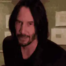 Keanu Reeves nodding and gesturing