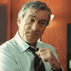 Robert De Niro adjusting his tie