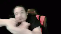 Man in chair doing arm wave dance