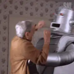 Old man hugs robot