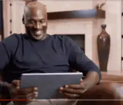 Michael Jordan laughing at tablet