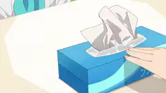 Hand pulling tissue from blue box