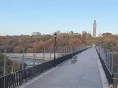 Empty bridge in autumn with clock tower