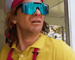 Man lifts sunglasses to reveal reflection