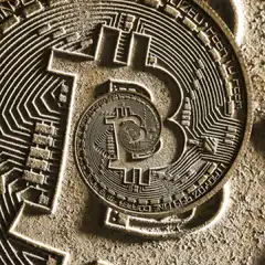 Gold Bitcoin coin with circuit patterns