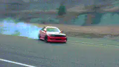 Red car drifting on a track
