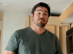 Man points to head thinking