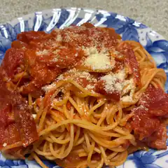 Spaghetti with tomato sauce and parmesan