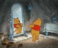 Winnie the Pooh admiring himself in the mirror