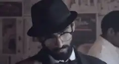 Man removes bowler hat