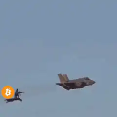 Bitcoin symbol shooting down fighter jet