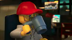 Lego man drinking coffee