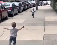 Two toddlers running to hug