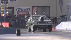 Green drag car wheelie