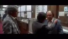 man pointing at wall in office