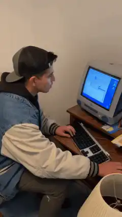 guy at computer gives thumbs up