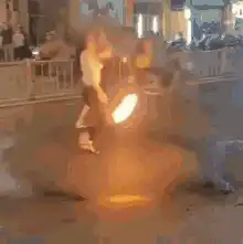 Man walks through fire ring