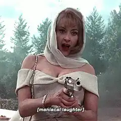 woman with gun laughing maniacally