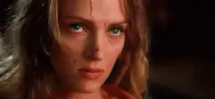 Bridget Fonda intense stare with blood