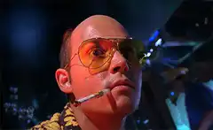 Bald man with sunglasses and cigarette