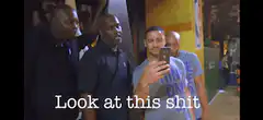 Stephen Curry looking at phone with caption