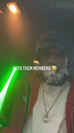 Man smoking with green laser light